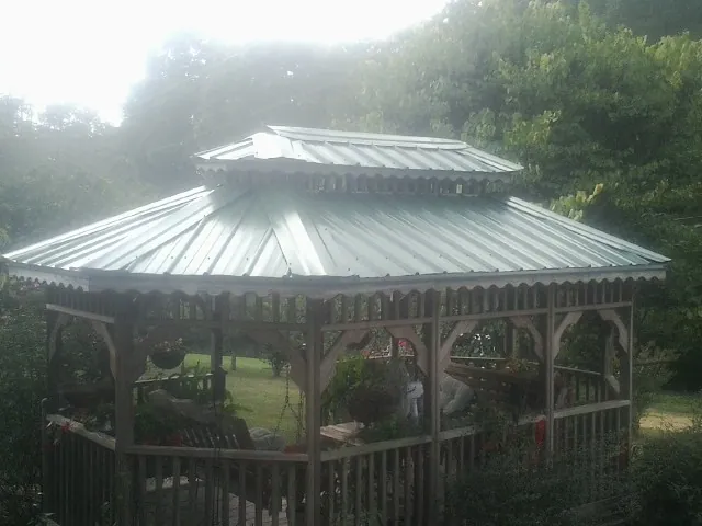 Two tier green metal roof on a garden gazebo in Whitehouse Station